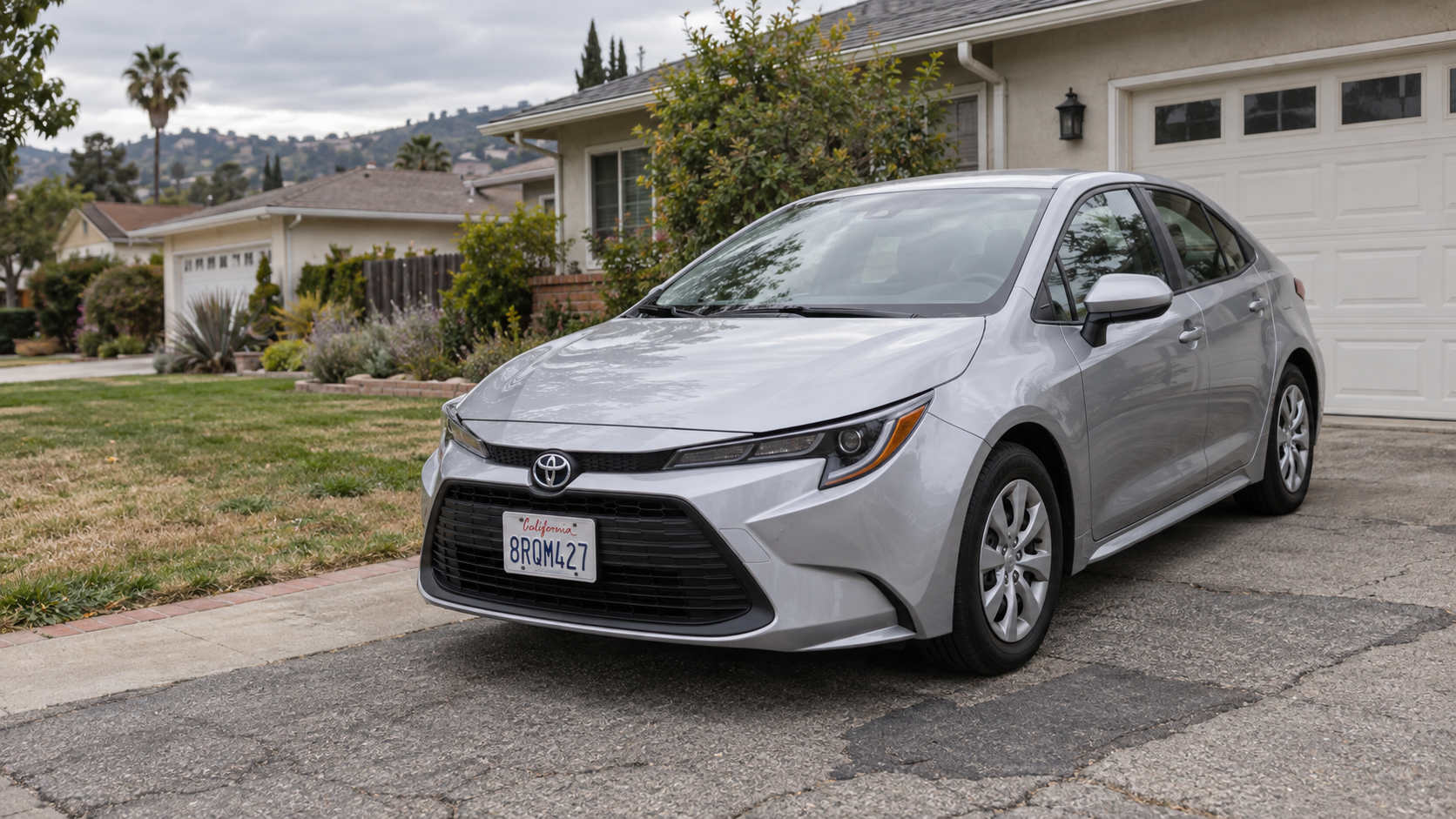 Editorial AI illustration: a silver Toyota Corolla parked on an ordinary residential driveway in California.